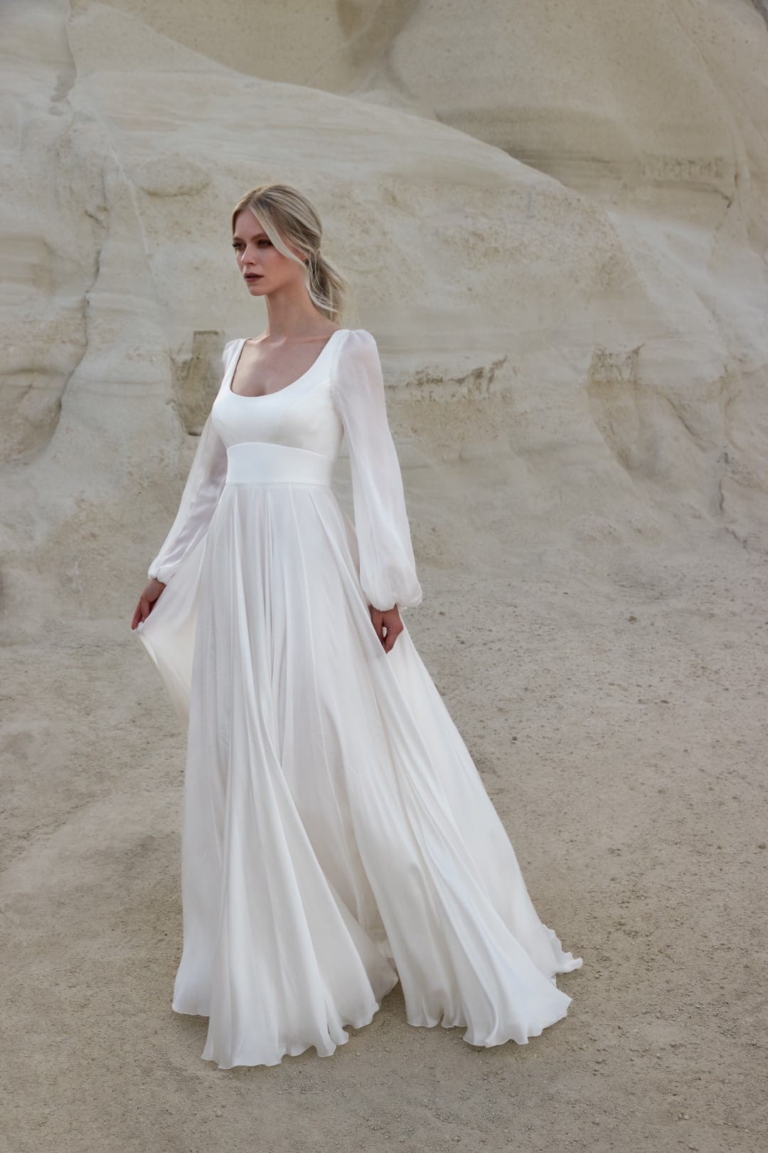 A perfect choice for minimalist brides, Sassi Holford Rhianna fits like a glove through the body, moving into soft flowing silk chiffon sleeves and a skirt that catch the light beautifully. Shop for your wedding dress at Your Dream Bridal Boston.